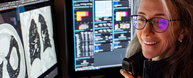 Beth Zigmund, MD looking at lung scans.