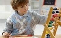 boy playing with abacus