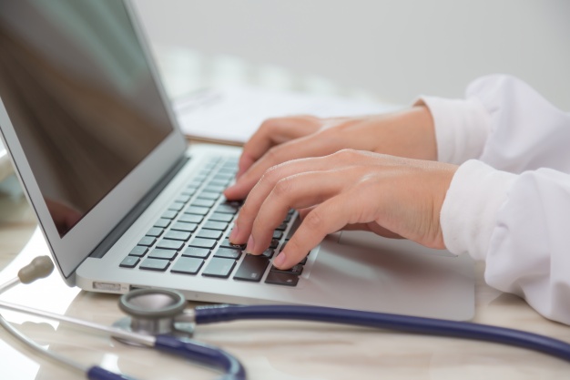 image of doctor using laptop