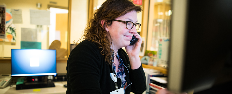 nurse speaking on the phone