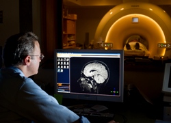 Man Looking at MRI of a patient's brain