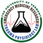 Trauma Physiology Lab Logo with Beaker containing image of a mountain and heart beat graph in background