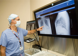 Dr. Leavitt with chest scans Dr. Leavitt with chest scans