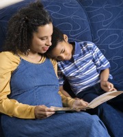 Mom reading to male child