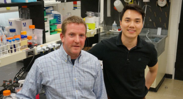 Diehl and Tu in lab Two men in a lab