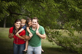 Parents and two young children