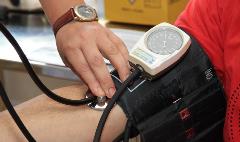 Getting Blood Pressure Volunteer has blood pressure taken
