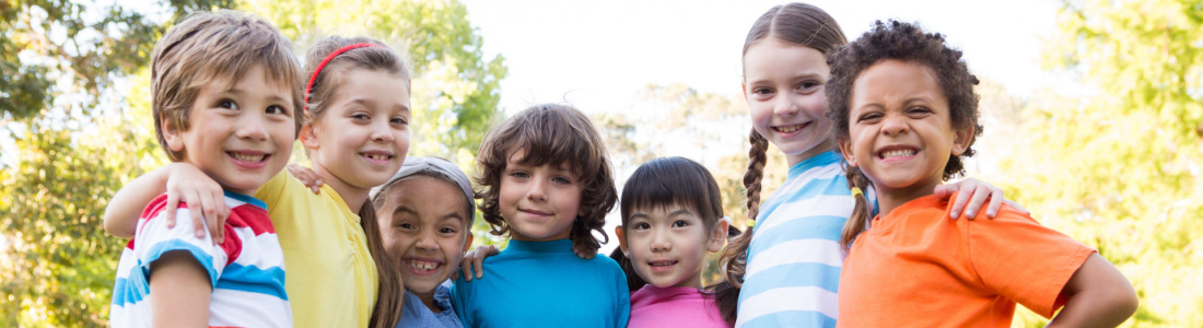 group of smiling kids outside