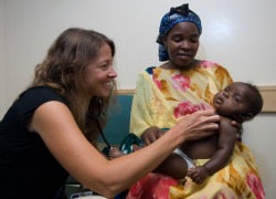 Physician with mother and child