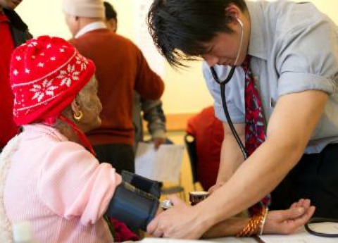 Physician takes a patient's blood pressure