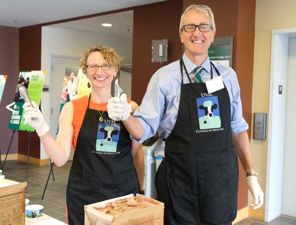 Drs Page and Zehle posing with ice cream scoops at the annual ice cream social