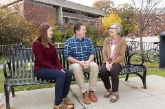 Jason Garbarino, clinical associate professor and vice chair, Nursing Undergraduate Program, and Janet Nunziata, Center on Aging associate director for education, talk with Emily Raymond, Intern at the Center.