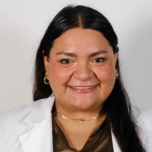 Krystal Ramos Barerra headshot in white coat