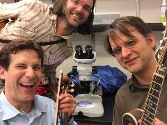 Kalev Freeman with musicians Matt Flinner and Matt Schrag in the lab
