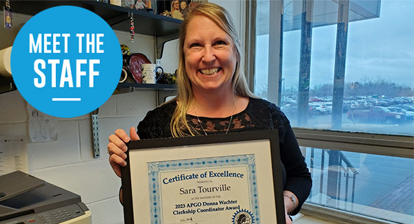 Sarah Tourville Happy Sarah Tourville holding staff excellence award