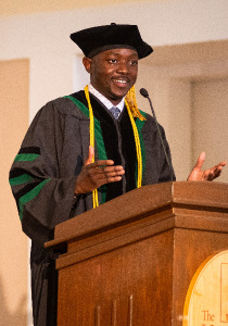 Mtuke Standing at Podium Mtuke Standing at Podium