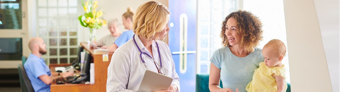 patients at medical practice talking to staff