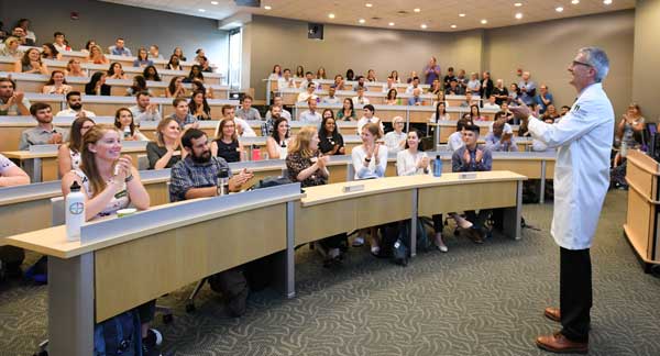 Dean Page greeting med students