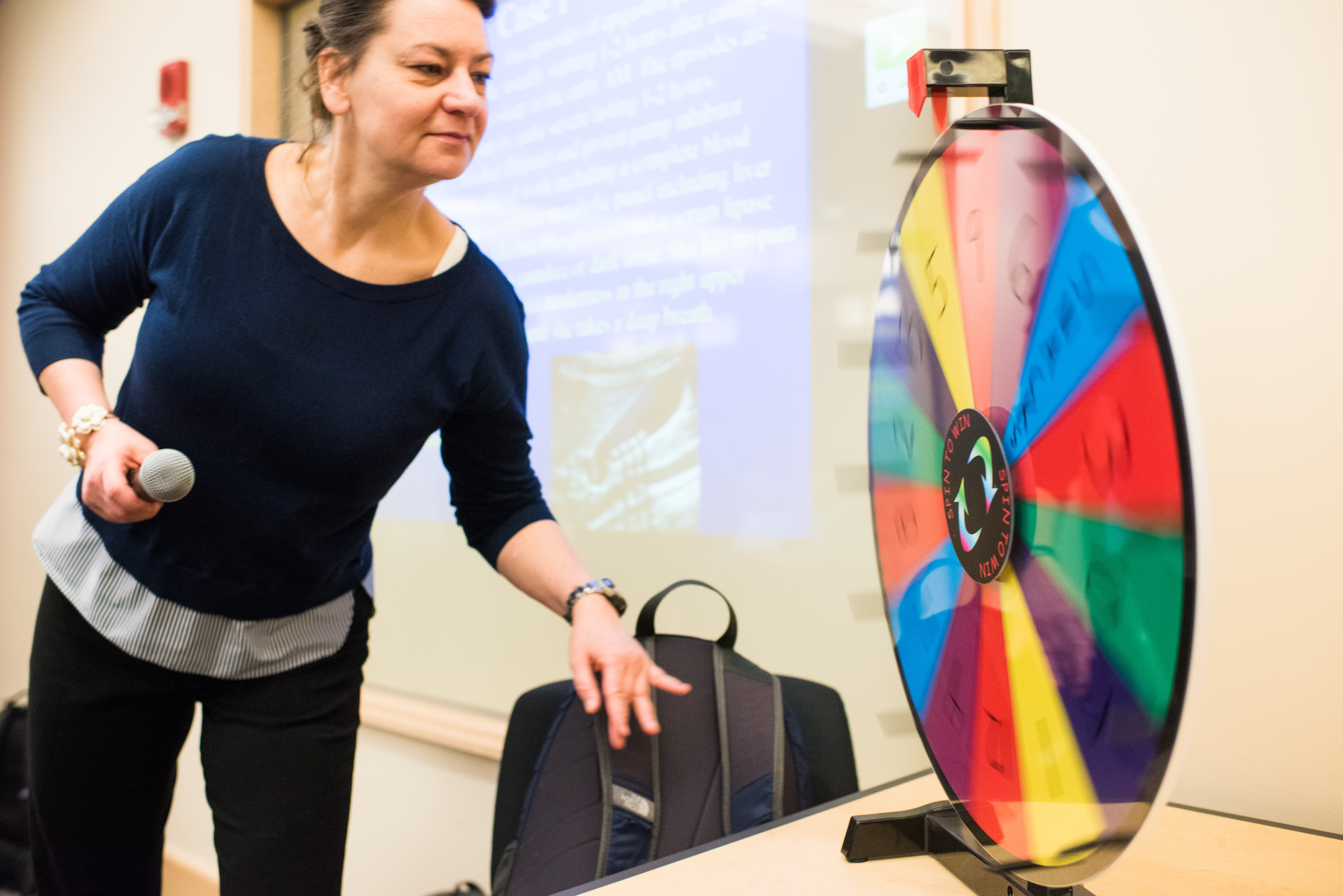 Student spinning wheel in active learning classroom