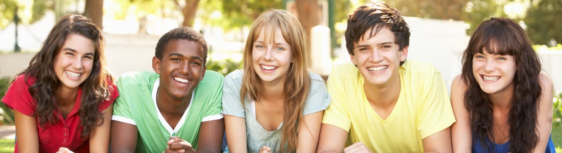 teenagers-lying-on-stomachs-in-park