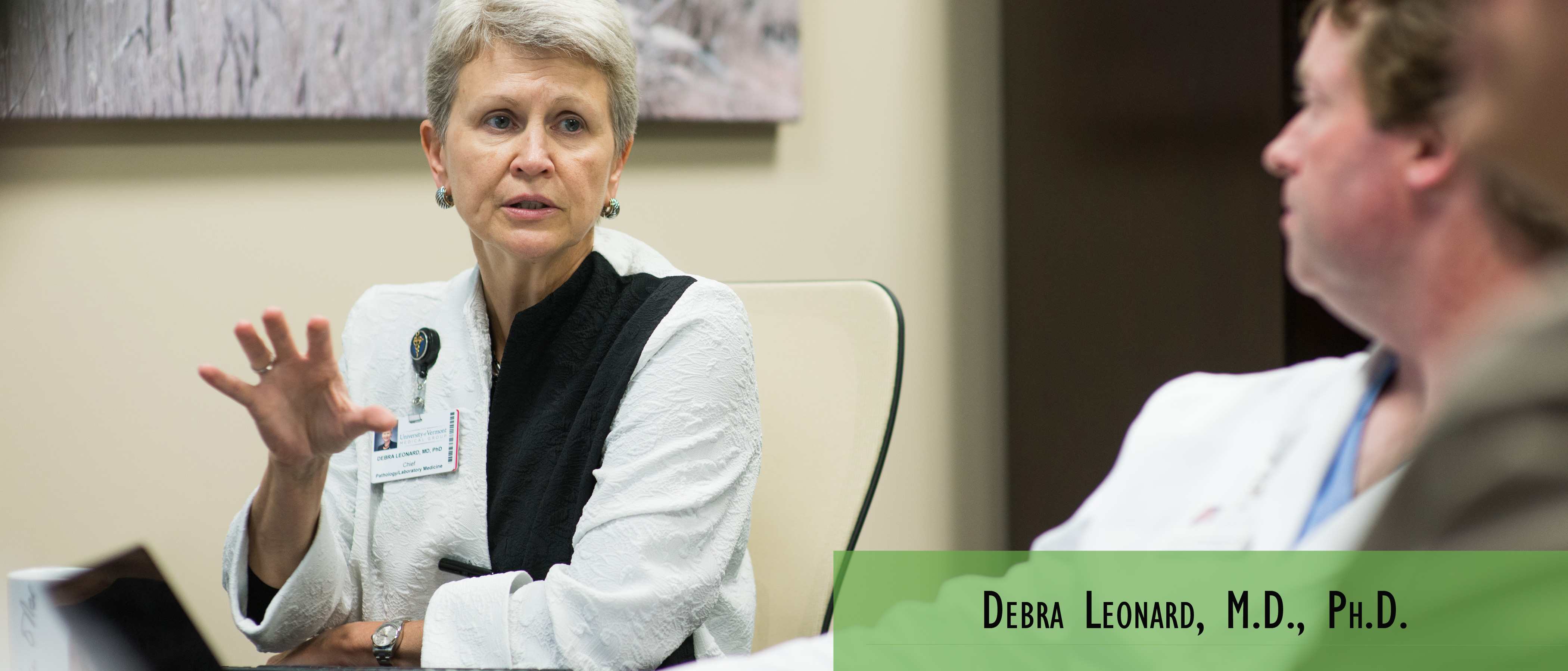 Debra Leonard, M.D., Ph.D., conducts a meeting with colleagues.